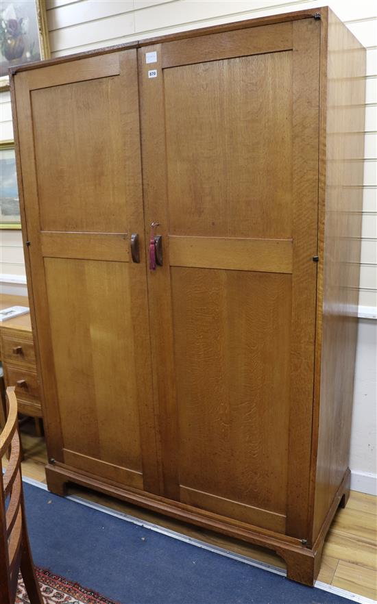 A Gordon Russell oak two door wardrobe W.122cm H.183cm
